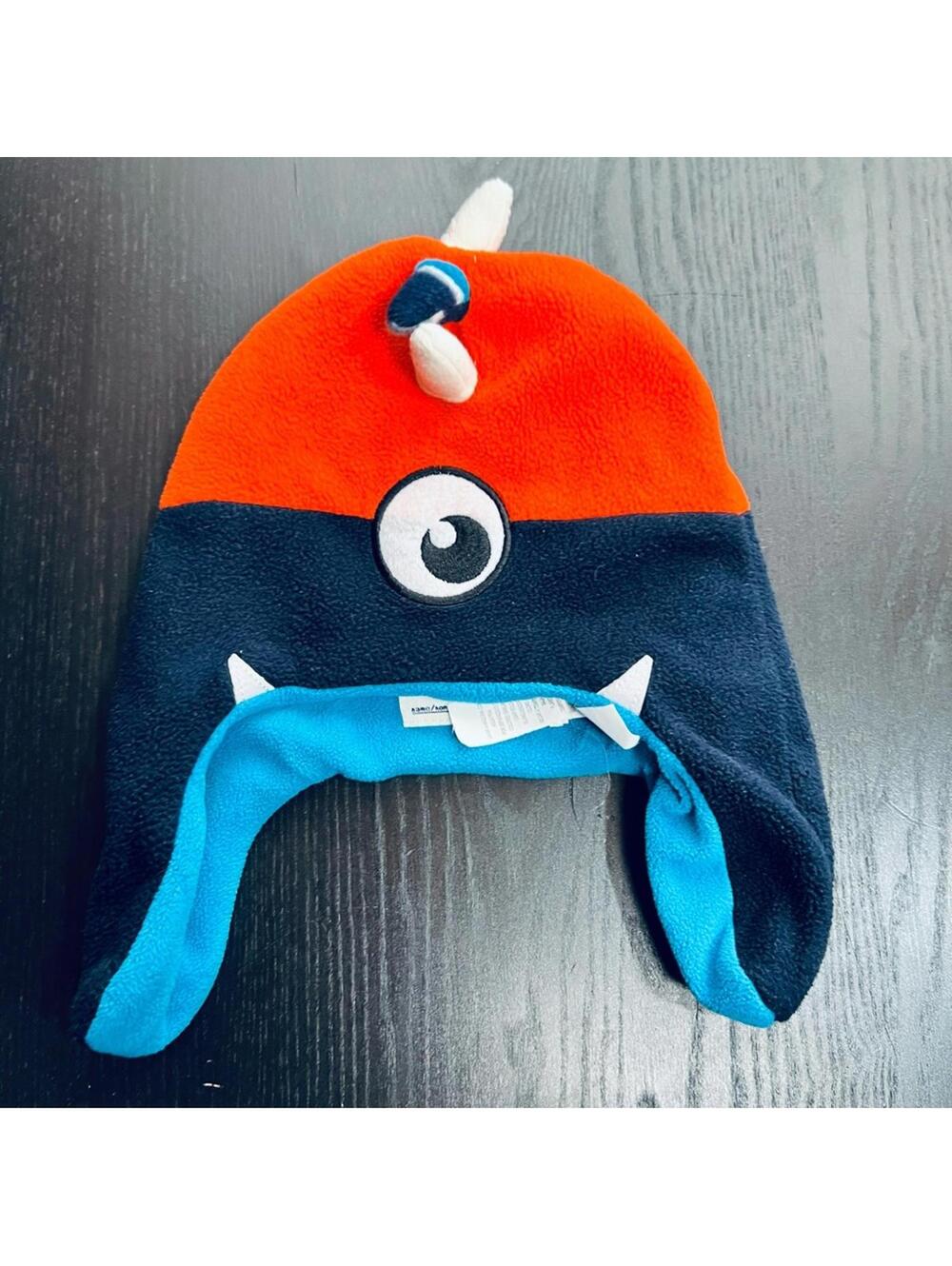Place Orange and Blue Monster Hat